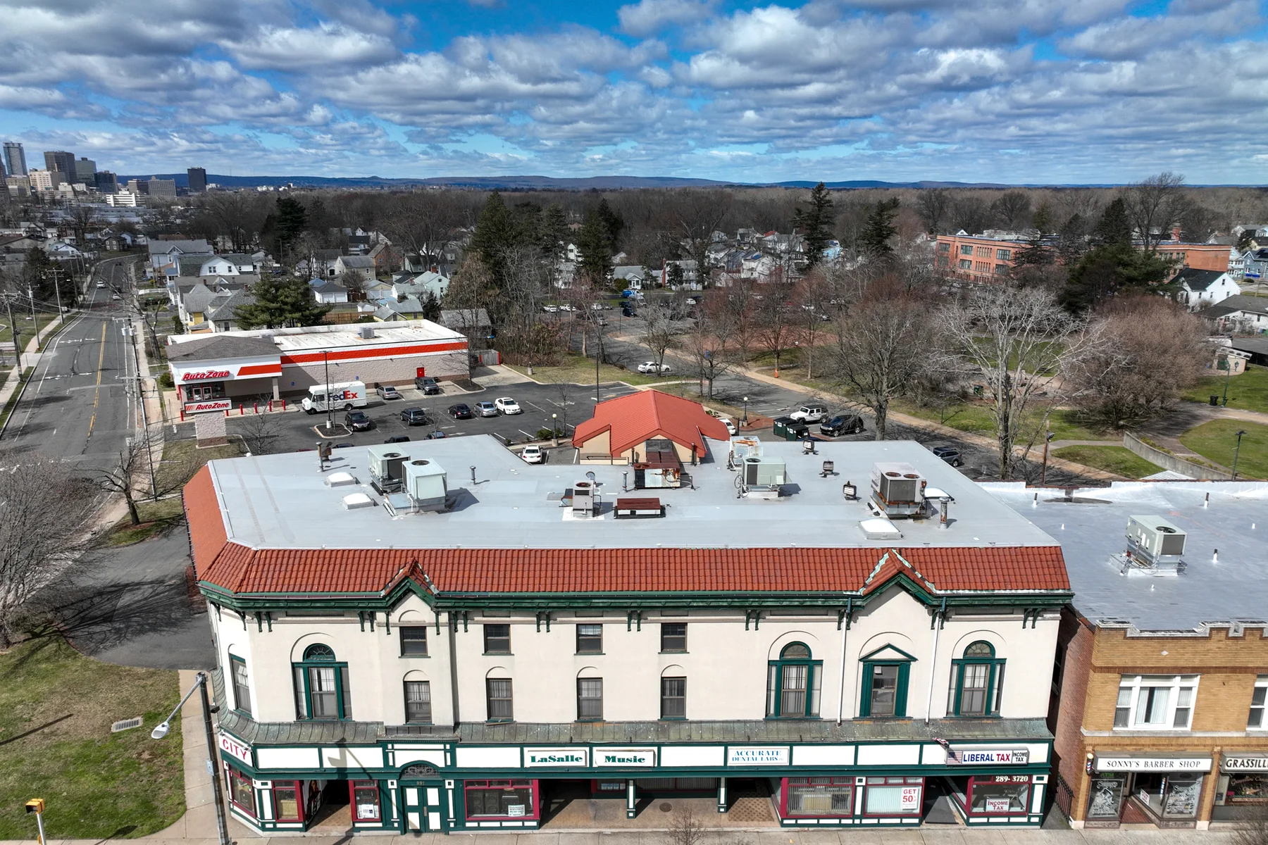 The full commercial frontage creates a continuous edge along the block.