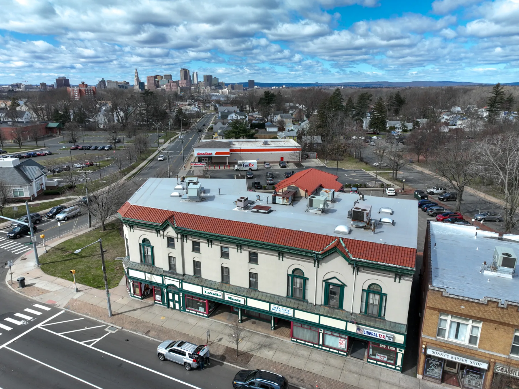 The final aerial connects the building's Main Street frontage to the Hartford skyline beyond.