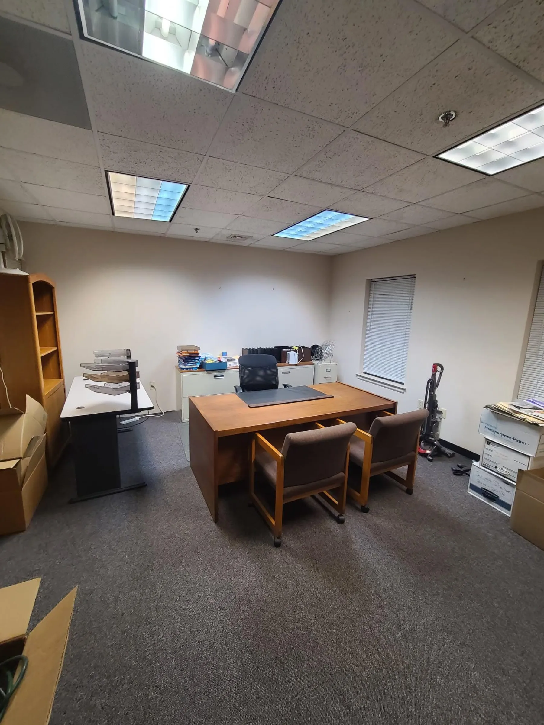 An occupied office shows the finished space in daily use rather than as an empty real-estate shell.